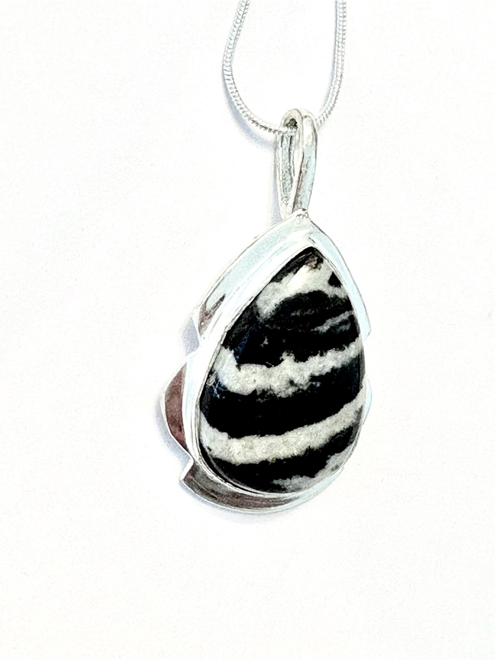 Beautiful, 2 inch, 925 marked, Buffalo Turquoise pendant on a silver chain.